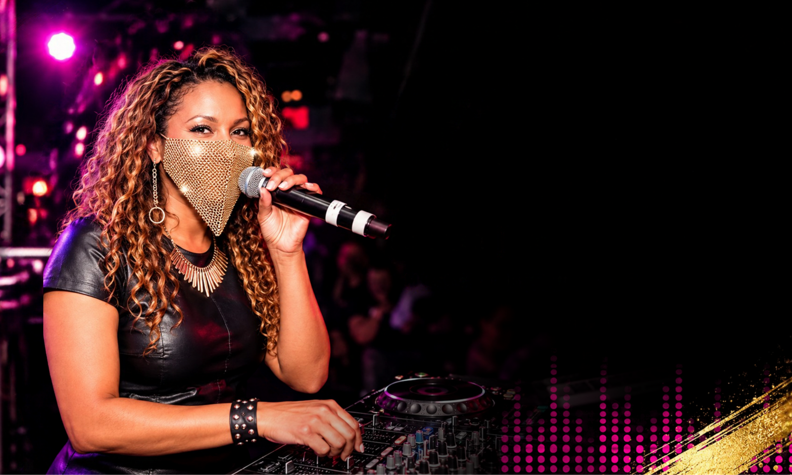 Malaika M-Love performing with a microphone and DJ equipment